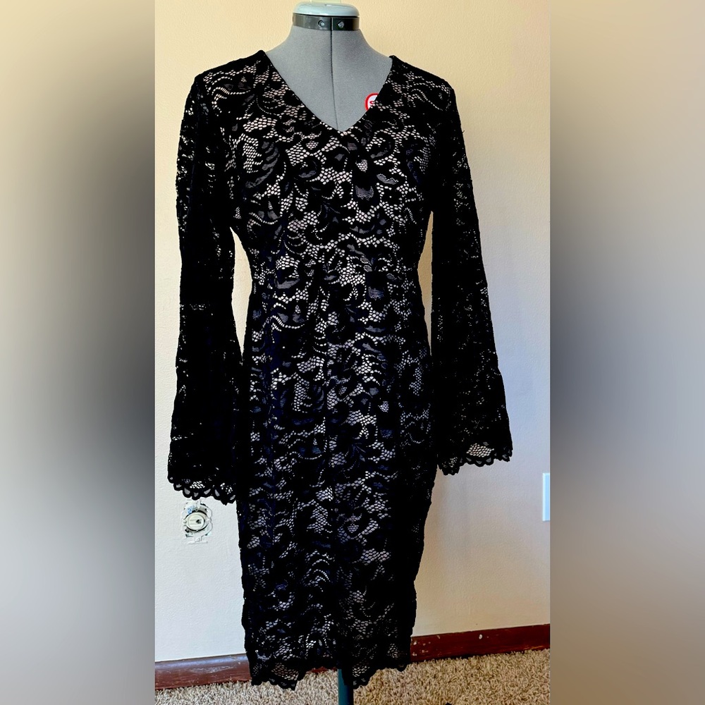 Nearly New Condition. Cocktail/semi-formal black lace dress. 3/4 length.